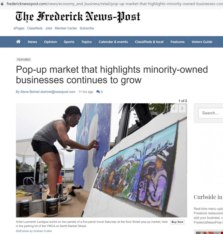 Newspaper article of black lives mural, a project initiatied by Lusmerlin as a black female artist
